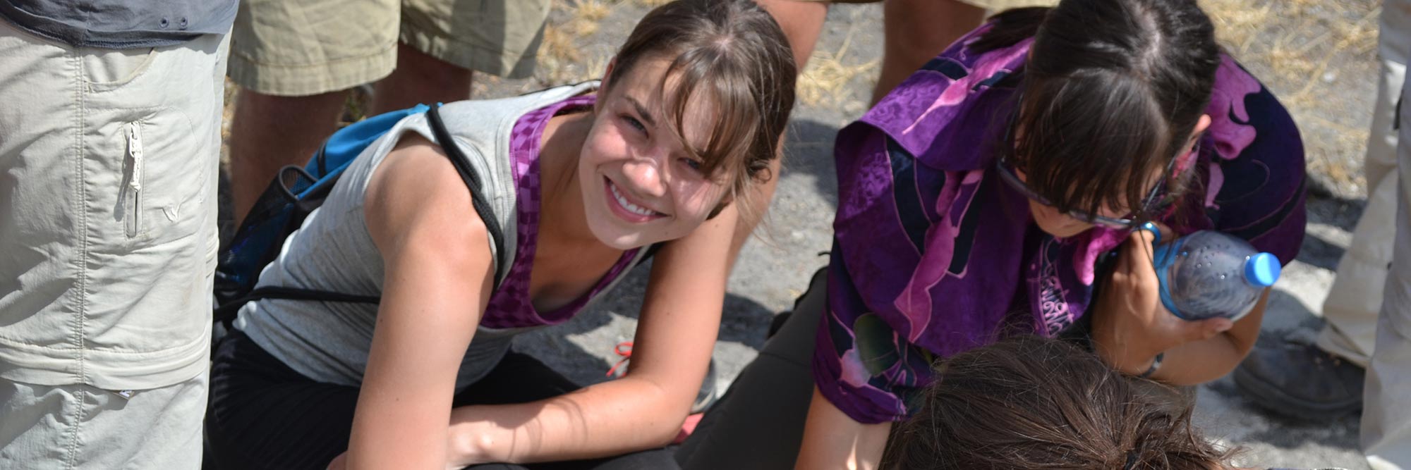 Student smiling while conducting field research