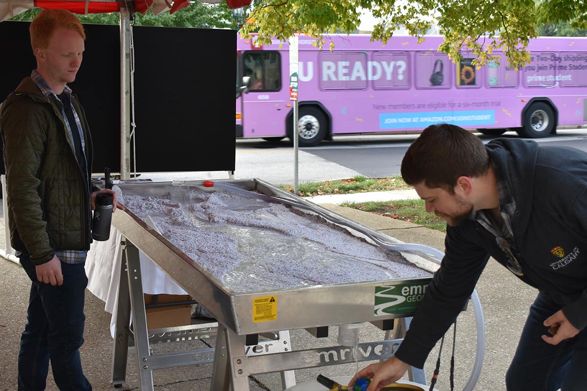 Earth and Atmospheric Sciences faculty setting up a demonstration