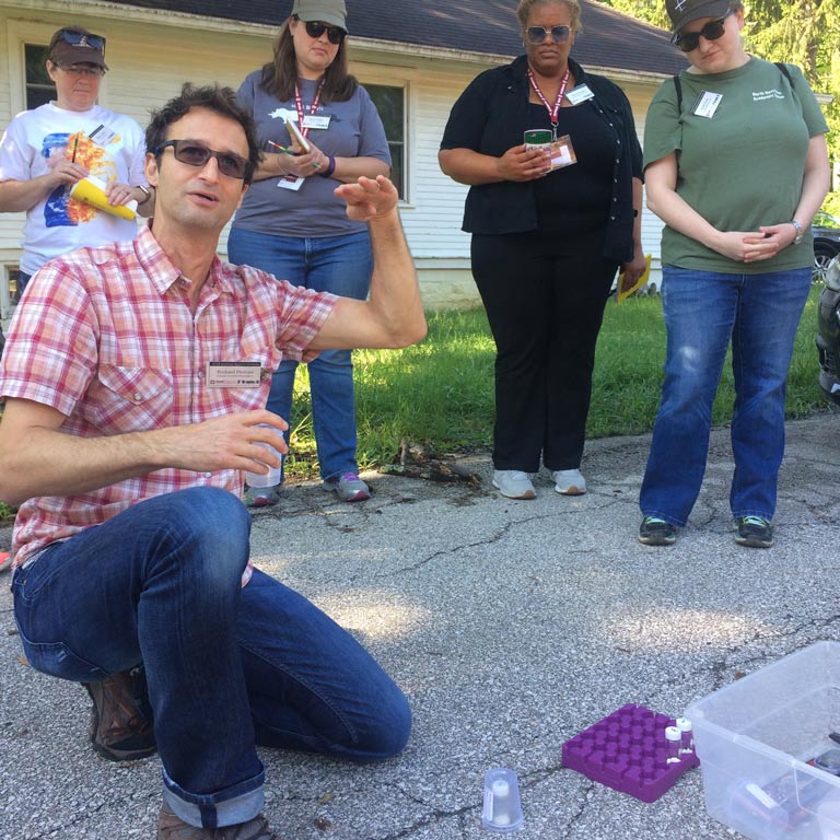 Instructor explaining an experiment to observers